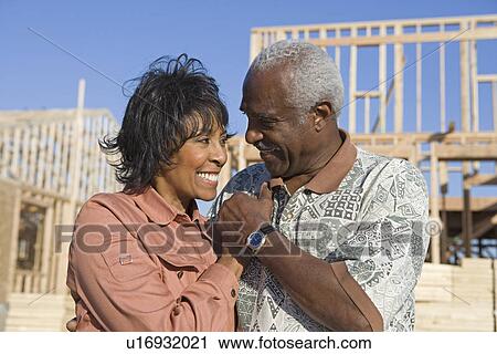 Middle-aged couple on construction site View Large Photo Image Stock Image - Middle-aged couple on construction site. Fotosearch