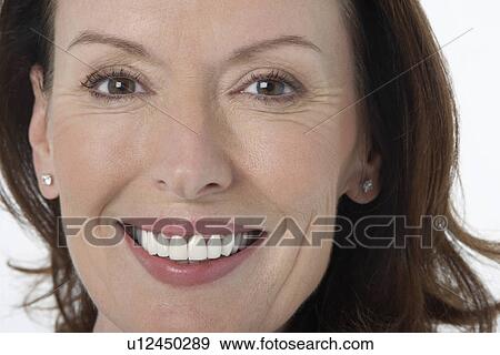 Middle-aged woman smiling big, close-up View Large Photo Image Stock Photo - Middle-aged woman smiling big, close-up. Fotosearch