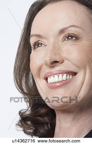 Middle-aged woman smiling big, close-up View Large Photo Image Stock Photograph - Middle-aged woman smiling big, close-up. Fotosearch