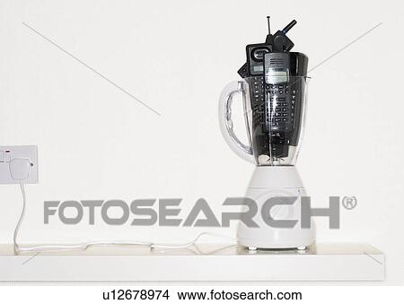 Mobile phones in electric blender View Large Photo Image Picture - Mobile phones in electric blender. Fotosearch