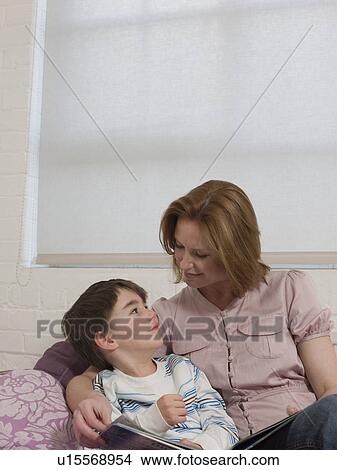 Picture - Mother Reading to Son. Fotosearch