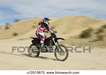 Motocross racer on bike in desert View Large Photo Image Stock Image - Motocross racer on bike in desert. Fotosearch