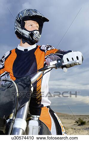 Motocross racer on bike in desert View Large Photo Image Stock Image - Motocross racer on bike in desert. Fotosearch