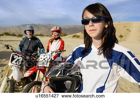 Motocross racers in desert, (portrait) View Large Photo Image Stock Photo - Motocross racers in desert, (portrait). Fotosearch