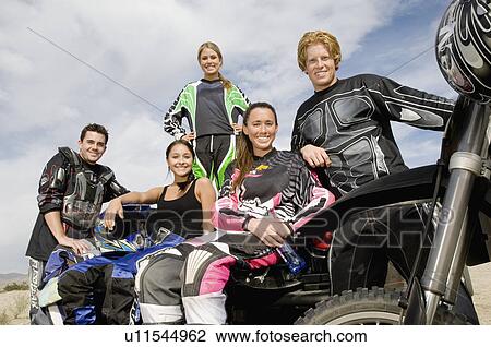 Motocross Racers, outdoors, (portrait) View Large Photo Image Stock Image - Motocross Racers, outdoors, (portrait). Fotosearch