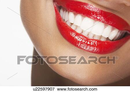 Stock Photo - Mouth with red lipstick, smiling. Fotosearch