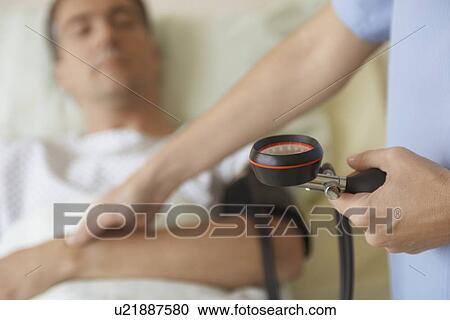 Nurse Taking Blood Pressure of Patient View Large Photo Image Stock Image - Nurse Taking Blood Pressure of Patient. Fotosearch