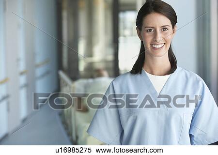 Stock Photography - Nurse with Patient in hospital Corridor, portrait, close up of nurse. Fotosearch