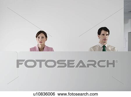 Office workers behind cubicle wall View Large Photo Image Stock Photograph - Office workers behind cubicle wall. Fotosearch