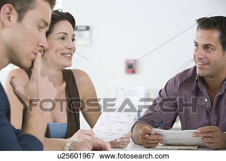 Office workers having conference View Large Photo Image Stock Photo - Office workers having conference. Fotosearch
