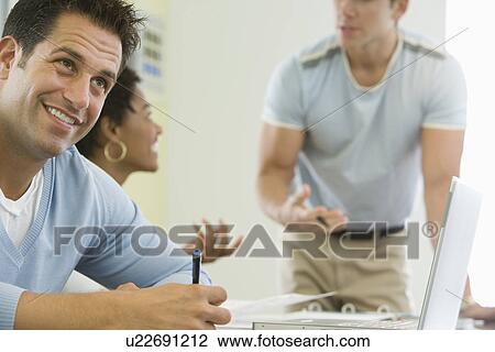 Office workers working on project View Large Photo Image Stock Image - Office workers working on project. Fotosearch