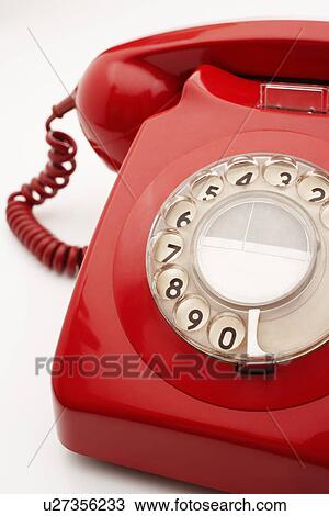 Old fashioned red telephone in studio, cropped View Large Photo Image Stock Image - Old fashioned red telephone in studio, cropped. Fotosearch