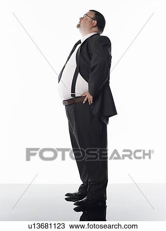 Overweight businessman, side view View Large Photo Image Stock Image - Overweight businessman, side view. Fotosearch