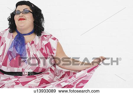 Overweight woman curtseying, portrait View Large Photo Image Stock Photo - Overweight woman curtseying, portrait. Fotosearch