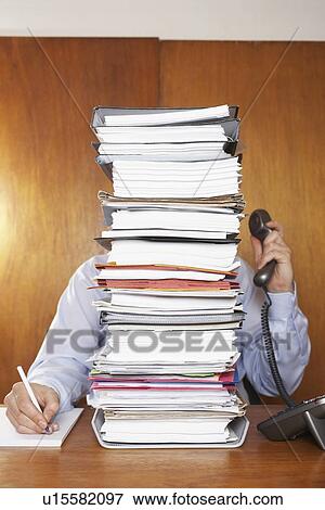Overworked Businessman at Desk View Large Photo Image Stock Photo - Overworked Businessman at Desk. Fotosearch