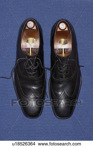 Picture - Pair of wing-tip shoes, view from above. Fotosearch