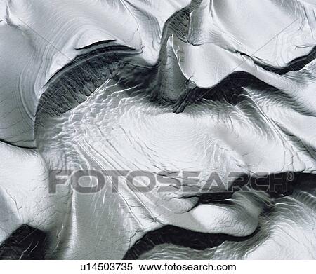 Stock Photography - Patterns in wet sand. Fotosearch