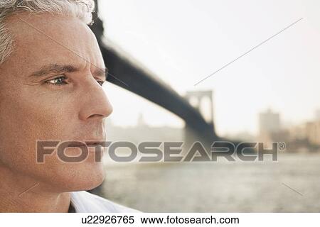 Pensive man by river View Large Photo Image Stock Photography - Pensive man by river. Fotosearch