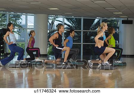 People Exercising in Step Aerobics Class View Large Photo Image Picture - People Exercising in Step Aerobics Class. Fotosearch