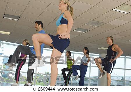 People Exercising in Step Aerobics Class View Large Photo Image Picture - People Exercising in Step Aerobics Class. Fotosearch