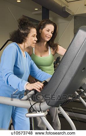 Personal Trainer Working with Senior Woman View Large Photo Image Stock Photo - Personal Trainer Working with Senior Woman. Fotosearch