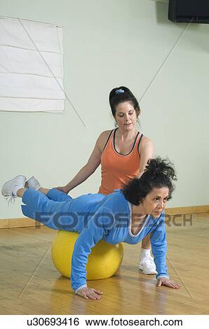Personal Trainer Working with Senior Woman View Large Photo Image Stock Photograph - Personal Trainer Working with Senior Woman. Fotosearch