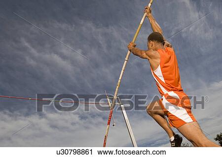Pole vaulted taking off View Large Photo Image Stock Image - Pole vaulted taking off. Fotosearch