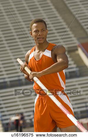 Stock Photography - Pole-vaulter preparing for jump. Fotosearch