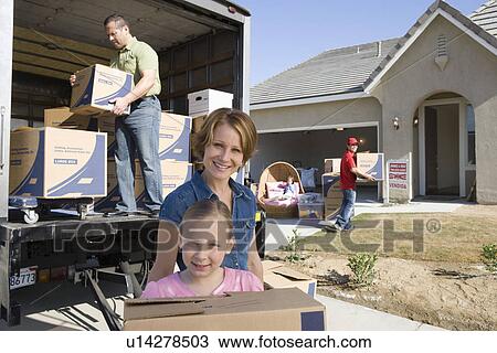 Portrait of family with daughter (7-9) unloading truck View Large Photo Image Stock Image - Portrait of family with daughter (7-9) unloading truck. Fotosearch