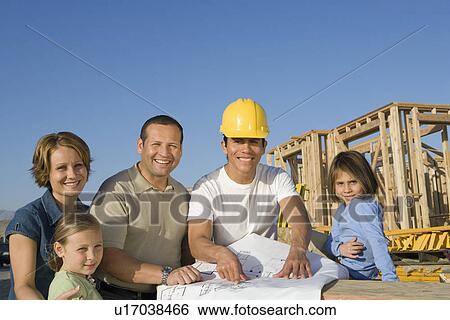 Portrait of family with two children (6-9) and construction side manager View Large Photo Image Stock Photograph - Portrait of family with two children (6-9) and construction side manager. Fotosearch