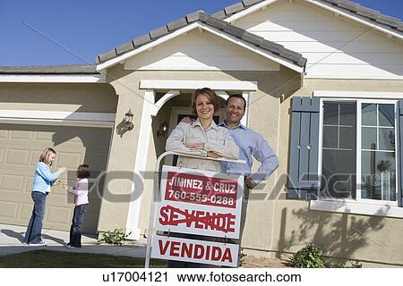Portrait of mid-adult couple in front of new house, children (6-9) in background View Large Photo Image Stock Image - Portrait of mid-adult couple in front of new house, children (6-9) in background. Fotosearch