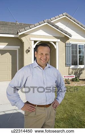 Portrait of mid-adult man in front of house, smiling View Large Photo Image Stock Image - Portrait of mid-adult man in front of house, smiling. Fotosearch