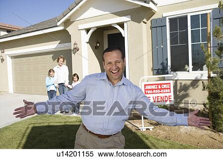 Portrait of mid-adult man in front of new house View Large Photo Image Stock Photography - Portrait of mid-adult man in front of new house. Fotosearch