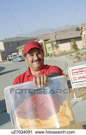 Portrait of mid-adult man moving into house View Large Photo Image Stock Image - Portrait of mid-adult man moving into house. Fotosearch