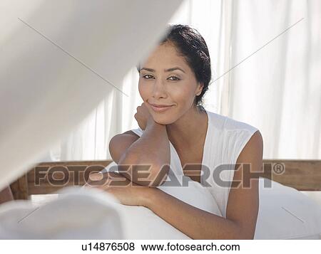 Stock Photo - Portrait of mid-adult relaxed woman. Fotosearch
