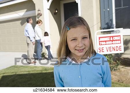 Portrait of pre-teen girl (7-9) in front of new house View Large Photo Image Picture - Portrait of pre-teen girl (7-9) in front of new house. Fotosearch