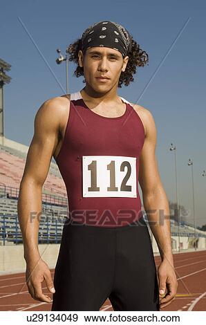 Portrait of runner, standing on a track View Large Photo Image Stock Photo - Portrait of runner, standing on a track. Fotosearch