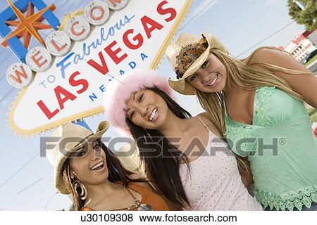 Portrait of women in front of Las Vegas welcome sign, Nevada, USA View Large Photo Image Stock Photo - Portrait of women in front of Las Vegas welcome sign, Nevada, USA. Fotosearch