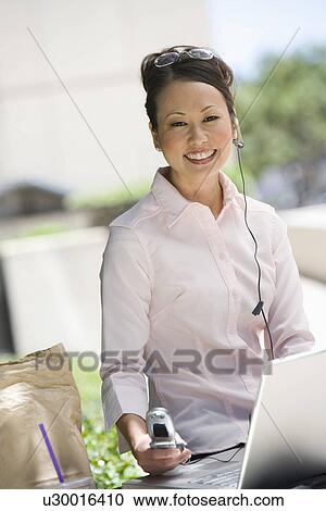 Portrait of young businesswoman having lunch break View Large Photo Image Stock Image - Portrait of young businesswoman having lunch break. Fotosearch