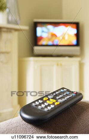 Picture - Remote Control and Flat-Screen Television. Fotosearch