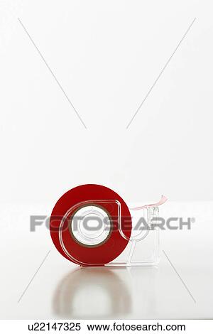 Roll of red tape in dispenser View Large Photo Image Stock Photography - Roll of red tape in dispenser. Fotosearch