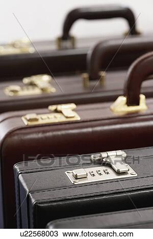 Stock Image - Row of briefcases in studio. Fotosearch