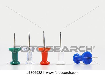 Row of five push pins facing up, one fallen over, close up View Large Photo Image Stock Image - Row of five push pins facing up, one fallen over, close up. Fotosearch