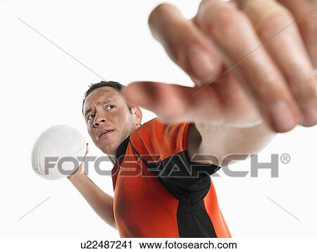 Stock Image - Rugby player preparing to pass ball. Fotosearch