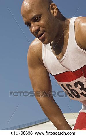Stock Photo - Runner on a track. Fotosearch