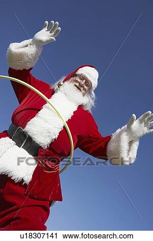 Stock Image - Santa Claus with Hula Hoop. Fotosearch