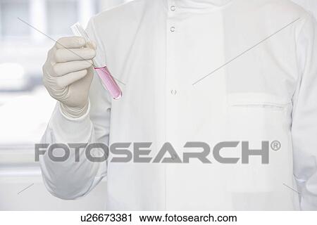 Scientist holding test tube sample, mid-section View Large Photo Image Stock Image - Scientist holding test tube sample, mid-section. Fotosearch