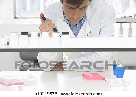 Scientist taking samples in laboratory View Large Photo Image Stock Photo - Scientist taking samples in laboratory. Fotosearch