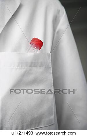 Stock Image - Scientist with test tube in lab coat pocket, close-up. Fotosearch