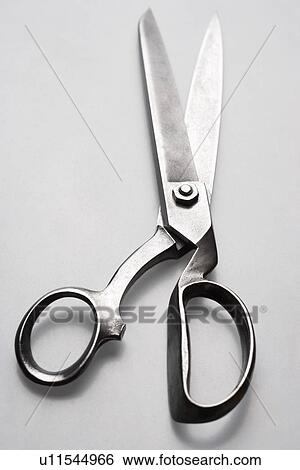 Stock Photograph - Scissors on white background in studio. Fotosearch